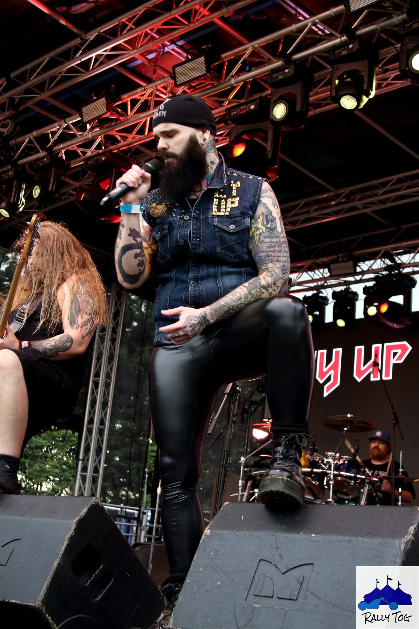 Ey Up Maiden singer with boot on stage monitor